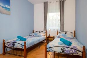 Posteľ alebo postele v izbe v ubytovaní Holiday House Jagoda + 28 fotografií
