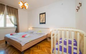 Posteľ alebo postele v izbe v ubytovaní Holiday House Jagoda