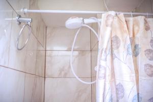 a shower with a shower curtain in a bathroom at Hermosos apartaestudios con WIFI in Bogotá