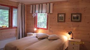 Postel nebo postele na pokoji v ubytování Lomakulkuri Apartments