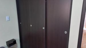 a pair of brown lockers in a room at Hermosos apartaestudios con WIFI in Bogotá