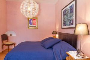 Una cama o camas en una habitación de unser rosa Haus für Sie
