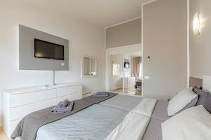 Postel nebo postele na pokoji v ubytování La Rosa de los vientos luxury apartment