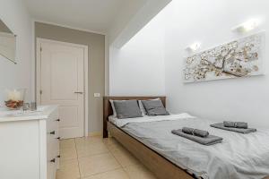Postel nebo postele na pokoji v ubytování La Rosa de los vientos luxury apartment