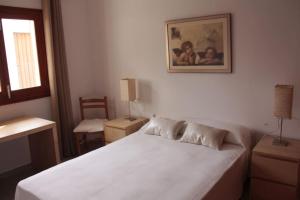 Ένα ή περισσότερα κρεβάτια σε δωμάτιο στο Bonito Chalet en Sa Ràpita