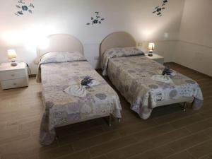 Postel nebo postele na pokoji v ubytování CASA INCANTO