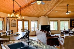 a kitchen and living room with a sink and a table at Sedona Serenity in Sedona