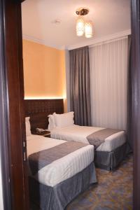 Cama o camas de una habitación en Dar Al Naem Hotel