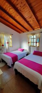 Кровать или кровати в номере Hotel Campestre Pueblo Bello