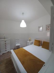 Ένα ή περισσότερα κρεβάτια σε δωμάτιο στο Casas Duarte 1