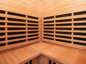 a sauna with wooden shelves in a wooden room at 5 person holiday home in Knebel in Knebel