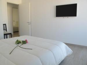 A bed or beds in a room at Penthouse Santa Croce