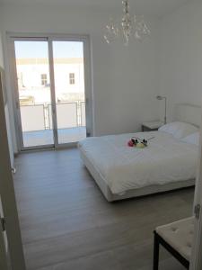A bed or beds in a room at Penthouse Santa Croce