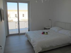 A bed or beds in a room at Penthouse Santa Croce