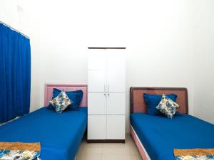 Postel nebo postele na pokoji v ubytování Griya One Family
