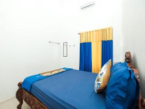 Postel nebo postele na pokoji v ubytování Griya One Family