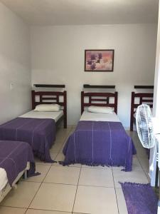 Giường trong phòng chung tại Recanto do Carreiro