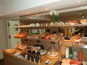 a buffet line with many different types of food at Residhome Arcachon Plazza in Arcachon