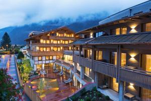 a hotel with a view of the courtyard and mountains at ElisabethHotel Premium Private Retreat- Adults only in Mayrhofen