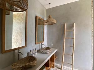 a bathroom with a sink and a ladder and a mirror at Villa Biarritz in Uluwatu +33 photos