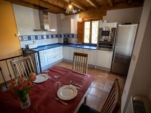 A kitchen or kitchenette at Belvilla by OYO Casa Rural Poza de la Torca II