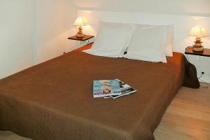 a book sitting on top of a bed at Apartment in Grandcamp for 4 Person in Grandcamp-Maisy +22 photos