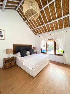 Tempat tidur dalam kamar di Eden Eco Resort