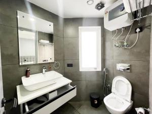 a bathroom with a sink and a toilet at BedChambers Serviced Apartments - Cyber City in Gurgaon