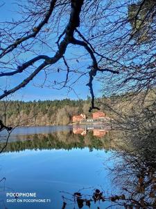 a house on the shore of a lake at Gîte L' Escale Ponote - Centre ville - Appart 90m2 in Le Puy en Velay +16 photos