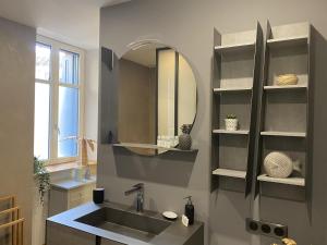 a bathroom with a sink and a mirror at L'équinoxe in Collioure +37 photos