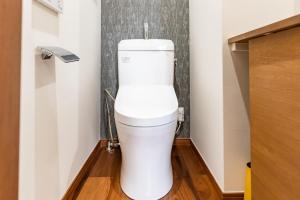 a bathroom with a white toilet in a room at 谷町君 星屋 神泉ノ宿 二条城 in Kyoto