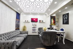 an office with a couch and a desk and a table at Armar Hotel in Istanbul