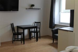 TV a/nebo společenská místnost v ubytování Boardinghouse Georgsheil + 2 fotografie