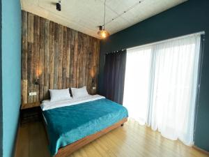 Llit o llits en una habitació de Hotel Misty Mountain