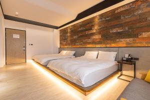 A bed or beds in a room at Sugar Island Inn