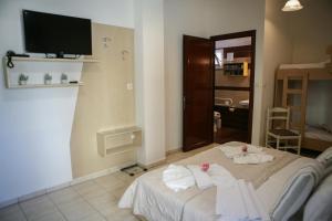 Postel nebo postele na pokoji v ubytování Hotel Karagianni