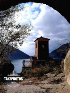 a small building on the side of a body of water at Casa Mediterraneo Perast in Perast