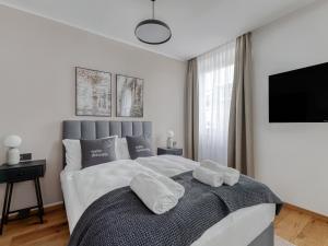 Łóżko lub łóżka w pokoju w obiekcie limehome Villach Gerbergasse