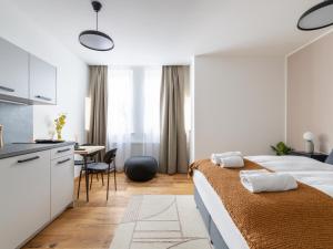 Łóżko lub łóżka w pokoju w obiekcie limehome Villach Gerbergasse