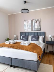 Łóżko lub łóżka w pokoju w obiekcie limehome Villach Gerbergasse