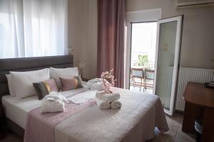 Postel nebo postele na pokoji v ubytování Hotel Karagianni
