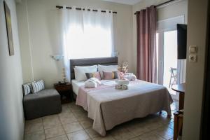Postel nebo postele na pokoji v ubytování Hotel Karagianni