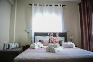 Postel nebo postele na pokoji v ubytování Hotel Karagianni