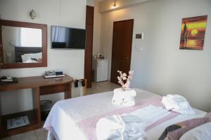 Postel nebo postele na pokoji v ubytování Hotel Karagianni
