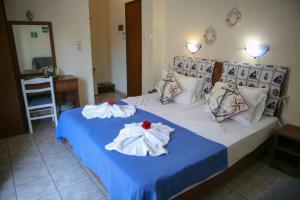 Postel nebo postele na pokoji v ubytování Hotel Karagianni