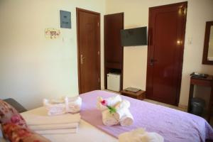 Postel nebo postele na pokoji v ubytování Hotel Karagianni