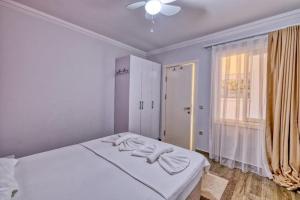 Postel nebo postele na pokoji v ubytování Dalyan Elit Apart Otel