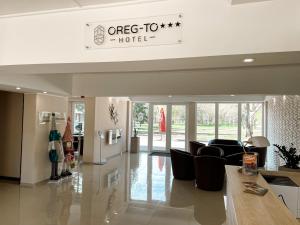 a lobby of a hotel with couches and chairs at Öreg-tó Hotel és Rendezvénytér in Tata