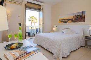 Кровать или кровати в номере Hotel Jonio