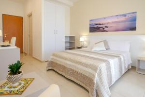 Кровать или кровати в номере Hotel Jonio
